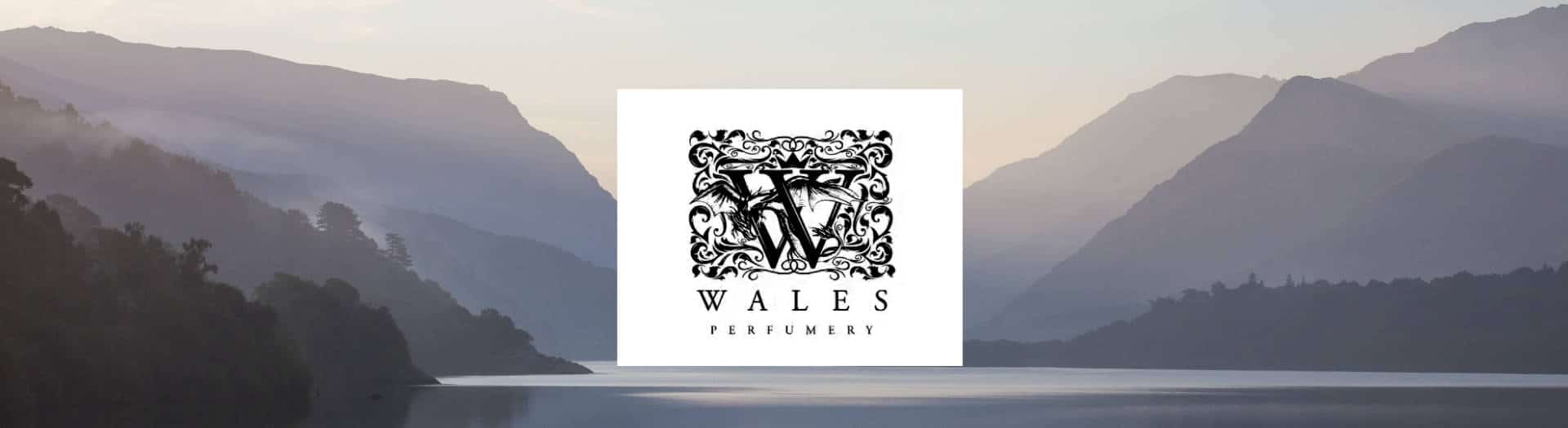 Wales perfumery brand header with logo on mountain background