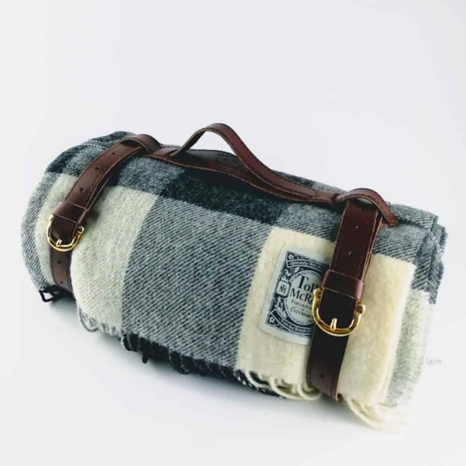 tolly mcrae black and white chunky picnic blanket, black and white check wool picnic rug, wool sofa throw with leather carry strap 1