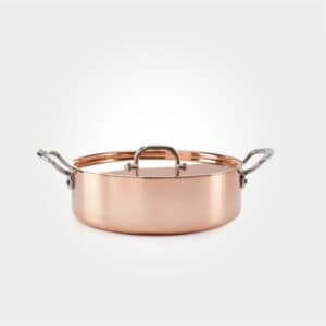 copper saute pan on white background