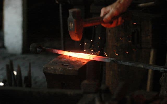 Blacksmith working metal