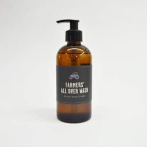 Farmers all over body wash brown bottle on white background