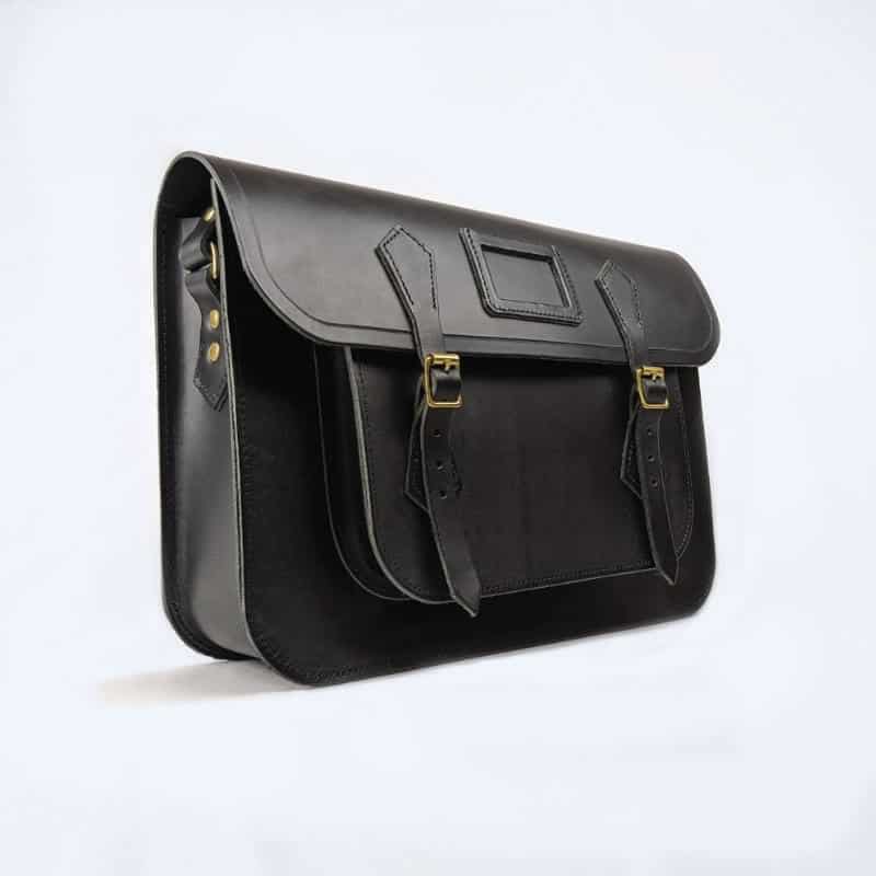 black leather satchel made in England on white bacground