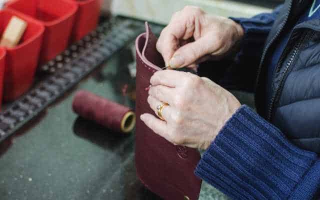 HB03 hands making leather bags