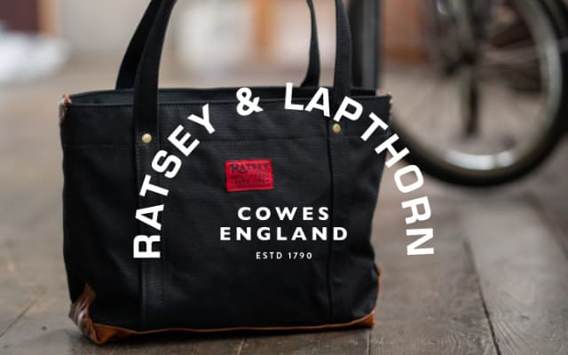 Ratsey and Lapthorn with white logo with british made canvas bag in workshop